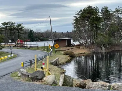 a road next to a river with a house at The Gap at Poconos- Sun Room-Arcade- Game Room in Long Pond
