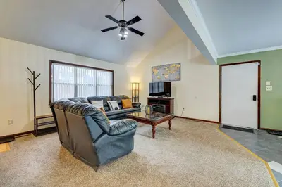 a living room with a couch and a ceiling fan at The Gap at Poconos- Sun Room-Arcade- Game Room in Long Pond