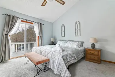 a bedroom with a bed and a window at Rustic Modern Retreat in Poconos in Albrightsville