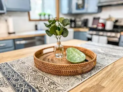 a wooden tray with a vase with a slice of lime at Rustic Modern Retreat in Poconos in Albrightsville
