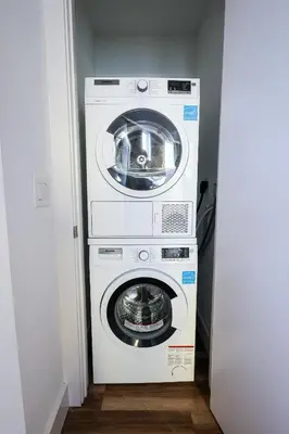 a washer and dryer in a small room at Studio Apartment in the Heart of Philadelphia in Philadelphia