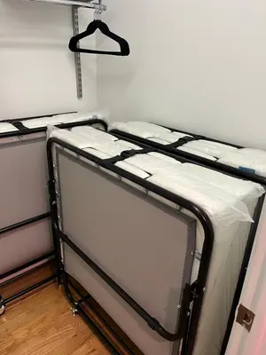 two bunk beds sitting in a room with a wall at The Orange Oasis in Bayonne