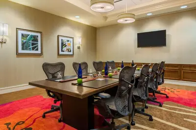 a conference room with a long table and chairs at Hilton Garden Inn Wayne in Wayne