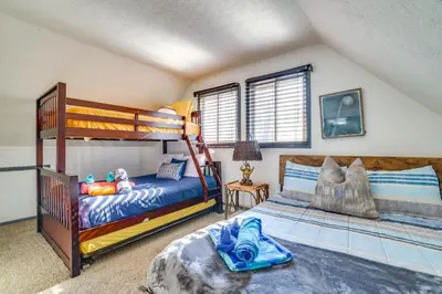a bedroom with two bunk beds in a room at Private Hot Tub and Game Room Pocono Family Cabin! in Tobyhanna
