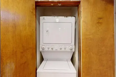 a white washer and dryer in a small room at 103 Ruffed Grouse Ct in Lake Harmony