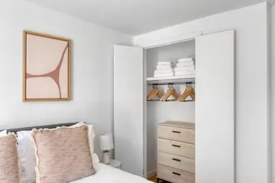 a bedroom with a bed and a closet at Nolita 2br w wd nr SoHo NYC-955 in New York