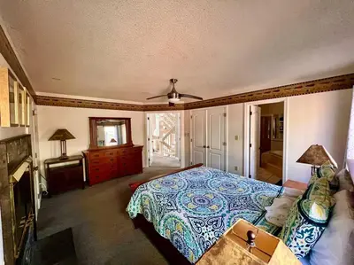 a bedroom with a bed and a couch at Lake Harmony 4bdrm Ski pool hot tub lake in Lake Harmony