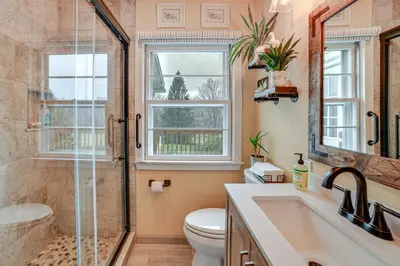 a bathroom with a shower and a toilet and a sink at 1 Mi to Historic District Mtn-View Franklin Home in Otego