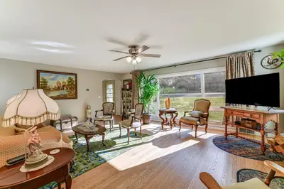 a living room with a flat screen tv and furniture at 1 Mi to Historic District Mtn-View Franklin Home in Otego