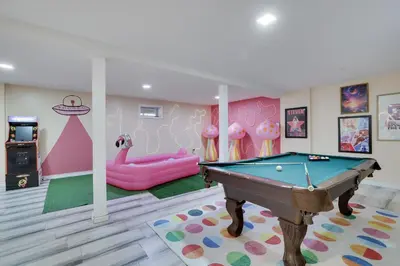 a room with a pool table and a pink room at 3BD Stevens Universe Theme - Games - Backyard in Tobyhanna