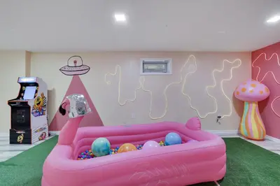 a childs play room with a pink couch with balls at 3BD Stevens Universe Theme - Games - Backyard in Tobyhanna