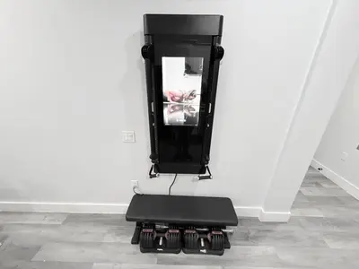 a black chair sitting in a corner of a room at The Luxury Suite - 1BR with Gym & Office in Paterson