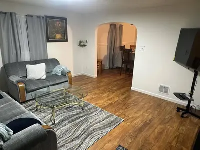 a living room with a couch and a table at Cozy 3BR Home near Downtown Lancaster in Lancaster