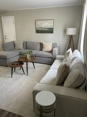 a living room with a couch and a table at Perfect Lehigh Valley Oasis in Bethlehem