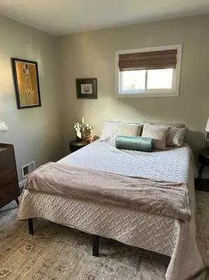 a bedroom with a large bed with a window at Perfect Lehigh Valley Oasis in Bethlehem