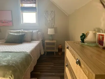 a bedroom with a bed with a dresser and a window at Perfect Lehigh Valley Oasis in Bethlehem