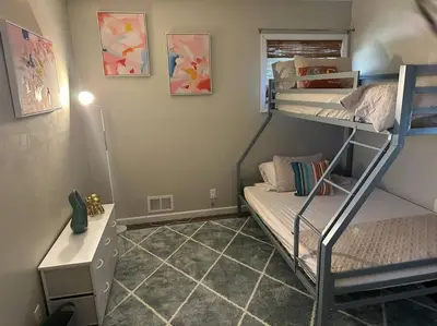 a dorm room with two bunk beds and a desk at Perfect Lehigh Valley Oasis in Bethlehem