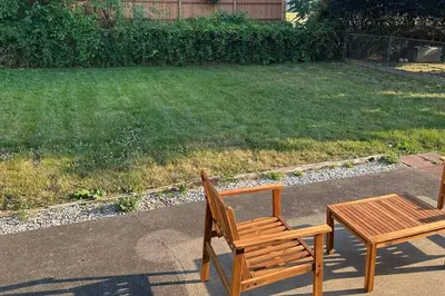 two wooden benches and a table in a yard at Perfect Lehigh Valley Oasis in Bethlehem
