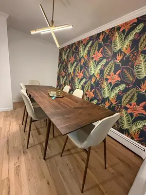 a dining room with a wooden table and chairs at Luxury Boutique Home - 5 Beds 2 Baths 25 minutes to NYC in Jersey City