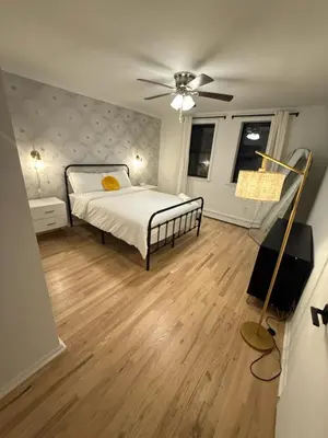 a bedroom with a bed and a ceiling fan at Luxury Boutique Home - 5 Beds 2 Baths 25 minutes to NYC in Jersey City
