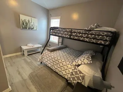a bedroom with two bunk beds in a room at Spacious 3 bedroom close to NYC in North Bergen