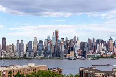 a view of a large city with a bridge at Manhattan Skyline Mins to TimeSQ in West New York