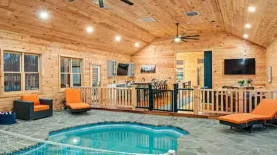 a living room with a swimming pool in a house at Grand Timber by AvantStay Indoor Pool Sports Court Game Room More in White Haven