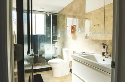 a bathroom with a toilet and a sink and a shower at The Philly Factory! in Philadelphia