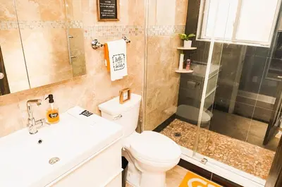 a bathroom with a toilet and a shower and a sink at The Philly Factory! in Philadelphia