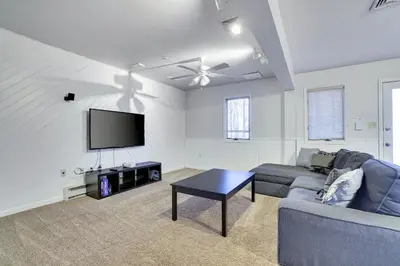 a living room with a couch and a flat screen tv at Lake Harmony Retreat Perfect Family Getaway in Lake Harmony