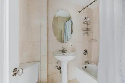 a bathroom with a sink and a mirror at Blueground Upper West Side ac wd NYC-1546 in New York