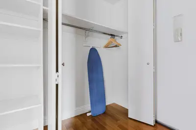 a blue surfboard hanging on a wall in a room at Blueground Midtown West 1bd apartment NYC-1625 in New York