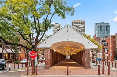 a brick archway with lights and a stop sign at Spacious 3-Bedroom Apt in the Heart of Philly in Philadelphia