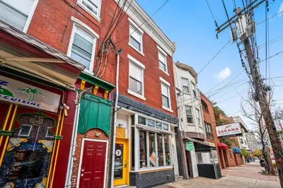 a group of buildings on a city street at Spacious 3-Bedroom Apt in the Heart of Philly in Philadelphia