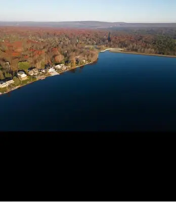 an aerial view of a large body of water at Cozy Cottage by the Lake in Albrightsville
