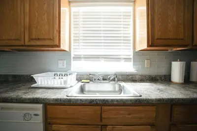 a kitchen counter with a sink and a window at Newark Liberty Brick House - Private Bedroom 1 in Newark