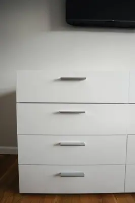 a white dresser with a tv on top of it at Newark Liberty Brick House - Private Bedroom 2 in Newark
