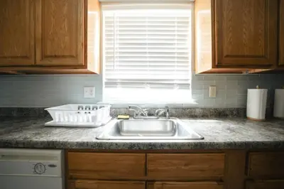 a kitchen counter with a sink and a window at Newark Liberty Brick House - Private Bedroom 3 in Newark