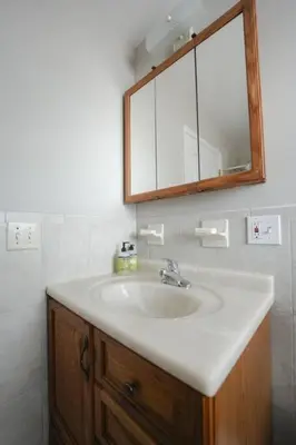 a bathroom with a sink and a mirror at Newark Liberty Brick House - Private Bedroom 4 in Newark