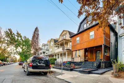 a van parked in front of a house at 15 Mi to NYC Apartment in Newark in Newark