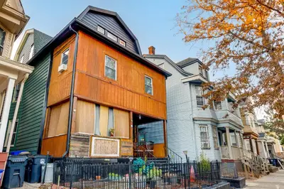 a house that is painted orange and gray at 15 Mi to NYC Apartment in Newark in Newark