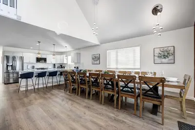 a kitchen and dining room with a table and chairs at New Luxury Lakeview Retreat with Lake Access, HotTub, Game Room, Sleeps 28 in Lake Harmony