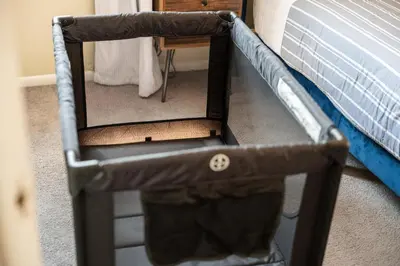 a bed frame with a mirror next to a bed at Stylish Apartment - Light Rail Access in Bayonne