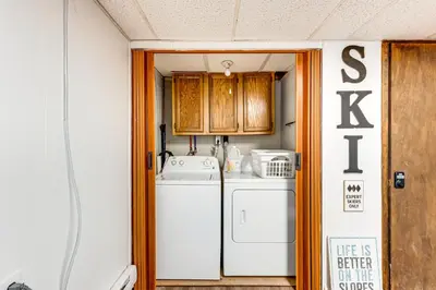 a laundry room with a washer and dryer at Arrowhead Lake Access and Fire Pit Serene Cottage in Pocono Lake