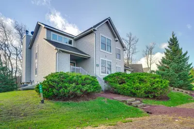 a house with a landscaping in front of it at 1 Mi to Waterpark Mtn-View Poconos Hideaway! in Tannersville