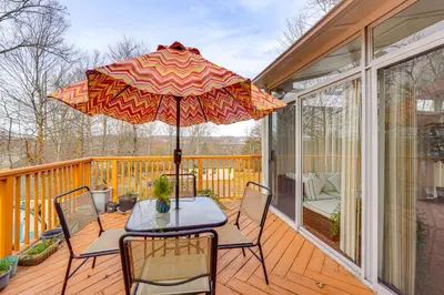 a patio with a table and chairs and an umbrella at Monroe Home Near LEGOland and State Parks! in Monroe
