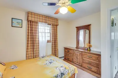 a bedroom with a bed and a dresser and a mirror at Monroe Home Near LEGOland and State Parks! in Monroe