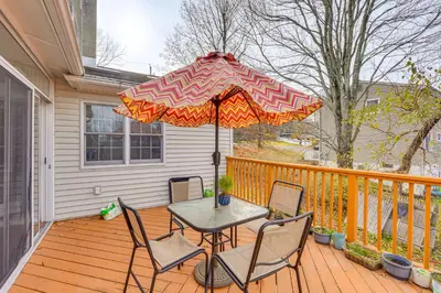 a patio with a table and chairs and an umbrella at Monroe Home Near LEGOland and State Parks! in Monroe