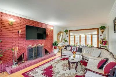 a living room with a red brick wall at Monroe Home Near LEGOland and State Parks! in Monroe