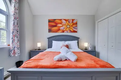 a bed with a stuffed animal sitting on top of it at Cozy Poconos Retreat Hot tub, Game room and igloo in Tobyhanna